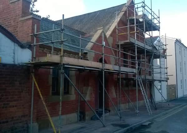Part of a former funeral directors empty for 15 years (during the works) and now home to 14 houses.