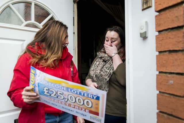 Sam is surprised on her doorstep by Lottery Ambassador Judy McCourt
