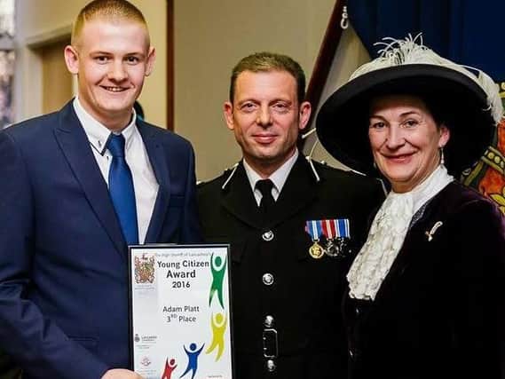Adam Platt receives a Young Citizen Award from assistant chief constable Mark Bates and Amanda Parker, High Sheriff of Lancashire at the time
