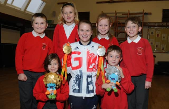 LEP - LONGRIDGE  09-11-16
Paralympic champion Stephanie Slater with pupils from Class Four at Longridge CE Primary School, as they interview Stephanie about her achievements thoughout her career and her experience at Rio 2016.