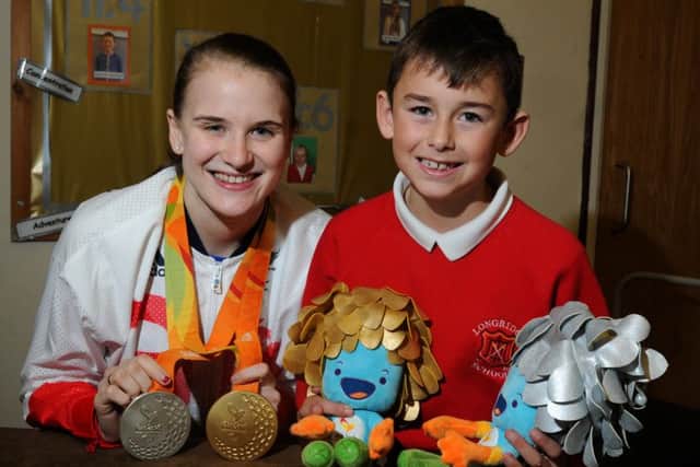 LEP - LONGRIDGE  09-11-16
Paralympic champion Stephanie Slater with Owen Garstang, nine, one of the pupils from Class Four at Longridge CE Primary School, as class interview Stephanie about her achievements thoughout her career and at Rio 2016.