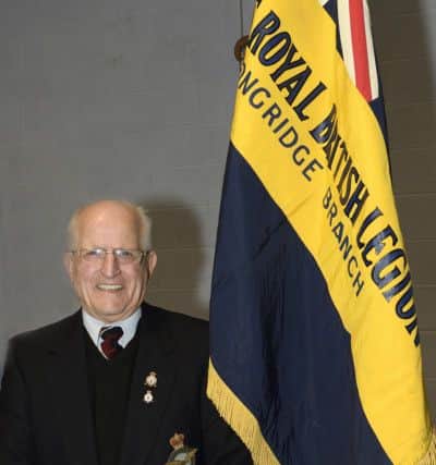 Former Longridge Royal British Legion chairman, secretary and standard bearer Ken Brierley with the Longridge Royal British Legion standard at the laying-up ceremony at Longridge High School.