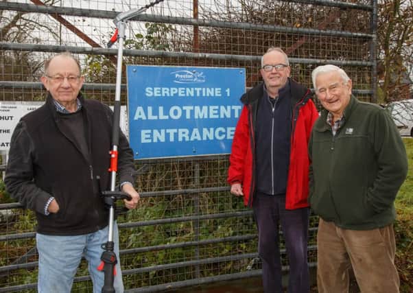 Bill Noblet, Ken Duckworth and Geoff Kirkby with their new hedge trimmer at Serpentine 1 Allotments in Preston.