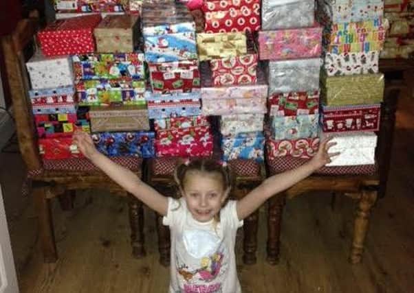 Macy Smith, seven with donated shoeboxes