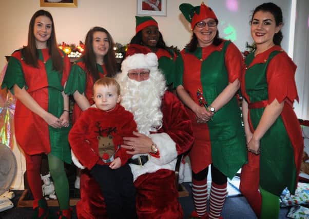 The Space Centre on Pedders Lane in Preston held a Christmas fair.
2 year-old William Ridealgh-Steel meets Santa and his helpers.  PIC BY ROB LOCK
10-12-2016