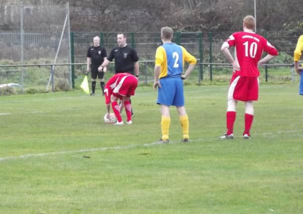 Alex Colquhoun prepares to open the scoring for Garstang from the penalty spot