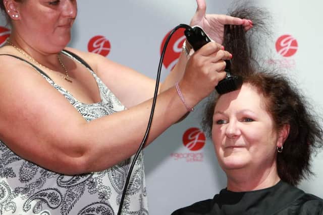 Alison Goodreid having her head shaved for Derian House Childrens Hospice and Great Ormond Street Hospital