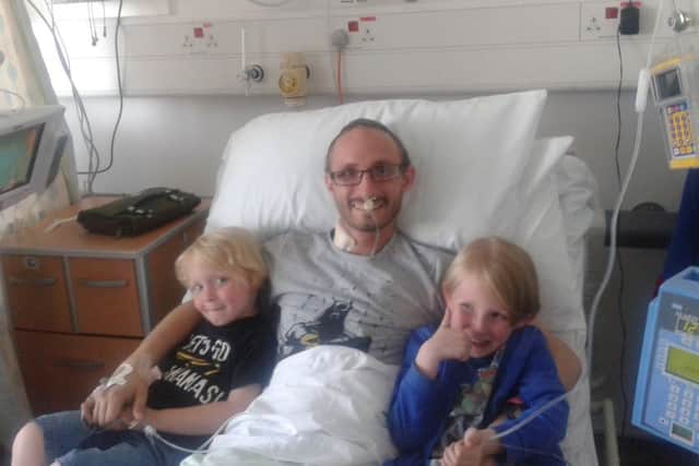 Ric Clark with his kids after his stomach operation