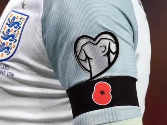 England wore poppies on their sleeves during the win against Scotland. (Photo: PA)