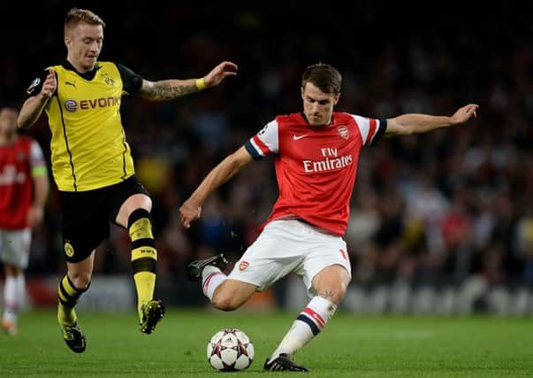 Marco Reus (left) has been linked with a move to Arsenal