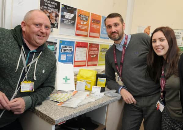 from left, Community engagement co-ordinator Wayne McGarrigan, team manager of Greater Manchester West Trust Aron Moss and health care worker Helen Sharples in the needle exchange, at the Coops Building, Wigan.