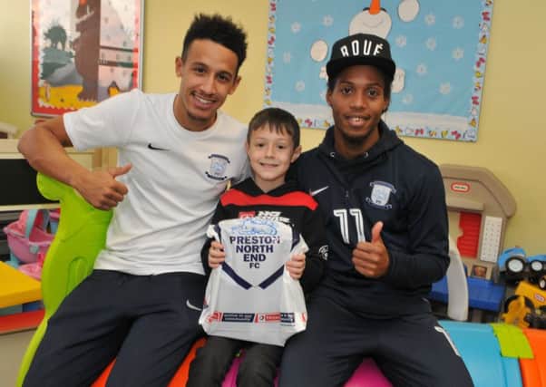 Callum Robinson and Daniel Johnson with young fan George Rimmer.