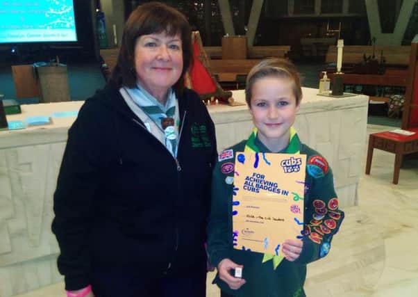 Leyland St Mary's Cub Jack Plowman, 10, with Ros Illingworth, assistant district commisioner for Cubs. 
He has achieved all of the Cub badges since joining aged eight.