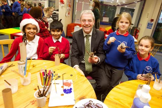 UCLan Vice Chancellor Prof Mike Thomas joined pupils from  Preston schools in a special festive  craft session to make gifts for  needy children