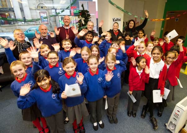 Pupils from Holy Family Catholic Primary School in Ingol and St Matthew's CE, New Hall Lane, joined forces to sing carols and make festive treats at the UCLan drop in shop in the city centre