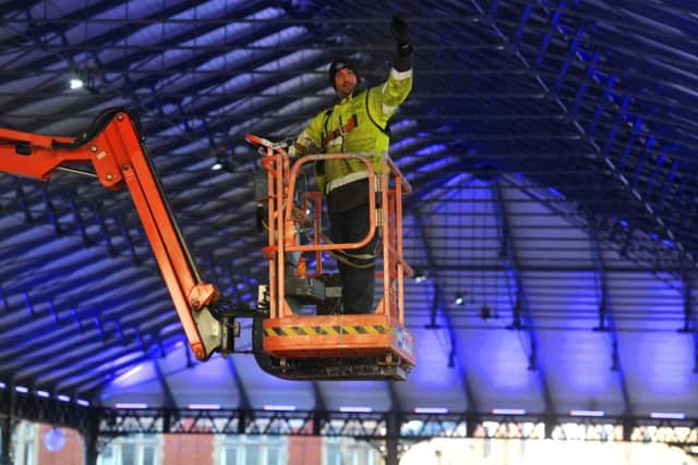 Photo Neil CrossPreparing for the reopening of the Larger Covered Market canopy following its full restoration and redecoration.