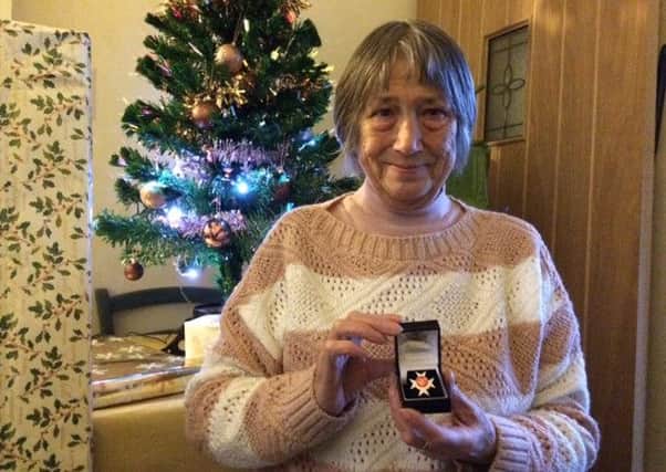 Beryl Swales with her Order of St John
