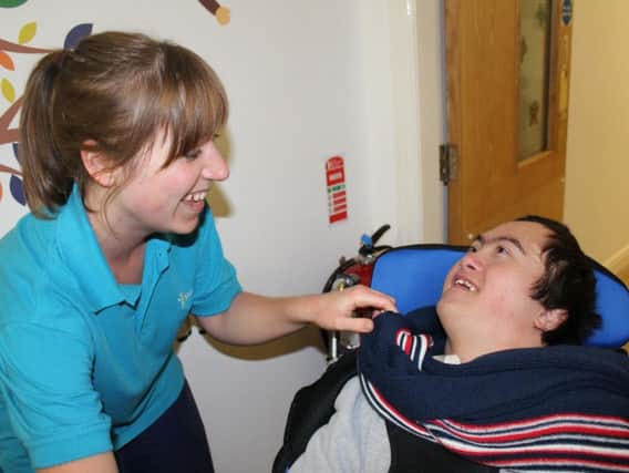 Louise Leach with one of the youngsters at Derian House