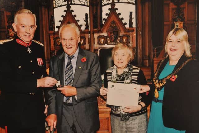 Dorothy and Edwin Hardman receive the Order of St John after donating Nigels organs