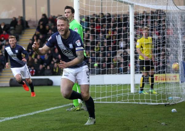 Tom Clarke celebrates the winner at Burton