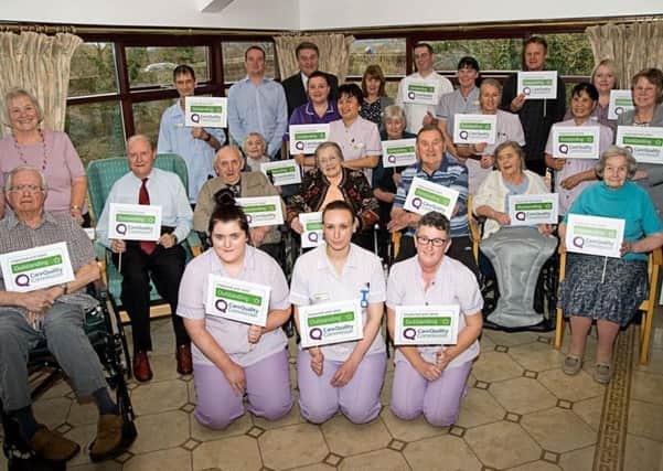 Staff and residents at Cornmill nursing and residential home in Garstang celebrate the outstanding rating