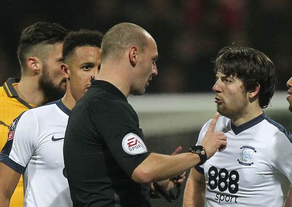 Ben Pearson is ticked-off by referee Robert Madley against Arsenal