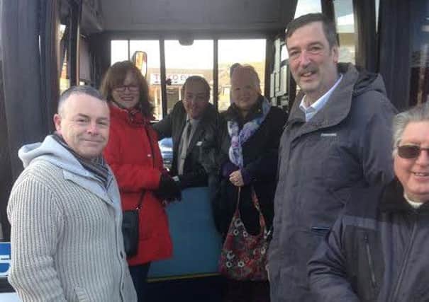 All aboard: Passengers, including councillor Matthew Tomlinson, on the new Avabus