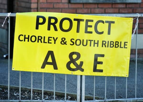 Protest outside Wigan Infirmary A&E to highlight the impact that the closure of Chorley's A&E is having on other hospitals. Wigan has been affected with patients now coming from Chorley.