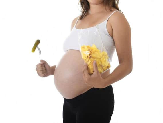 Mums who pile on the pounds during pregnancy are no more likely to give birth to a baby that develops heart problems in later life