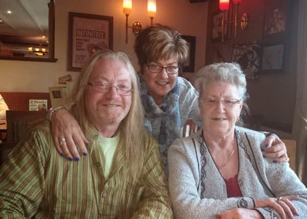 Barbara Lowe, 81, from Adlington narrowly missed being tricked out of almost Â£2,500 by a scammer.Barbara is pictured with her son Neil Cooper (left) and Carolyn Cooper (right)