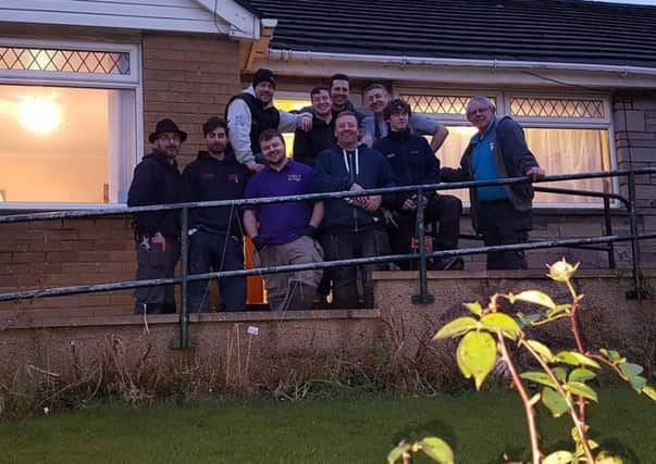 The team of local engineers who gave up their time to help fit a new heating system at a house in Crag Bank.