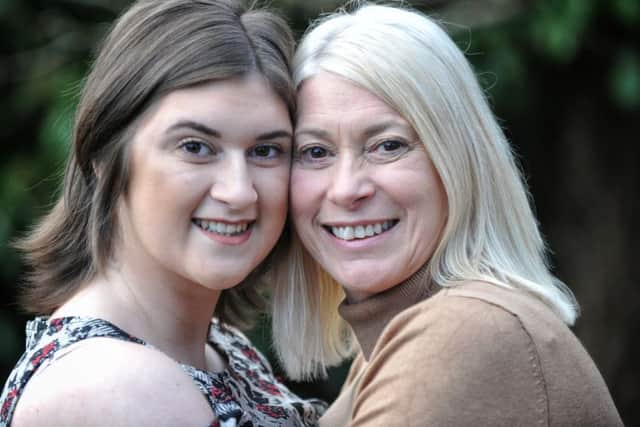 Picture by Julian Brown 14/01/17

Shaunha pictured with mum Tracy at their Burnley home

Shaunha Webster, 18, of Burnley, who went out on Boxing Day a year ago and after drinking, fell down the stairs and banged her head. She was taken to Royal Preston Hospital where her condition deteriorated and she almost died as she suffered bleeding and swelling in the brain. Surgeons had to remove parts of her skull to allow her brain to swell and she was in hospital for a month and has now had titanium plates fitted to replace the missing pieces of her skull.