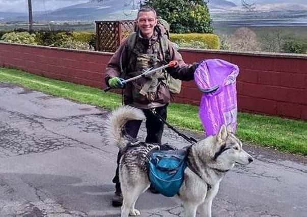 Wayne Dixon and his dog Koda, from Clitheroe, as he makes his way around the coast of Britain litter-picking as he goes.