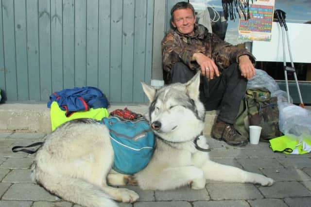 Wayne Dixon and his dog Koda, from Clitheroe, as he makes his way around the coast of Britain litter-picking as he goes.