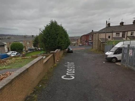 The body of a man was found at a premises on Cross Fold