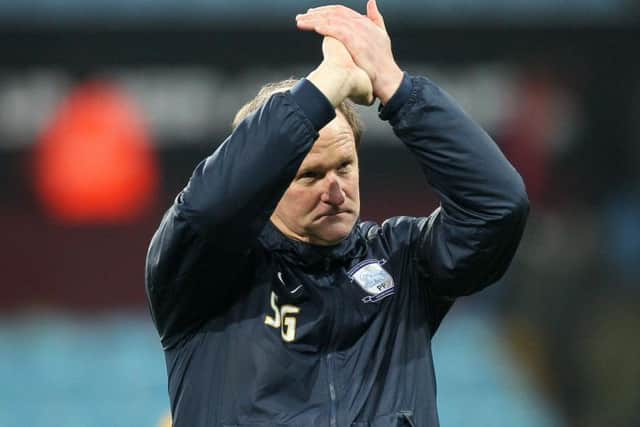 PNE manager Simon Grayson applauds the travelling supporters at the final whistle