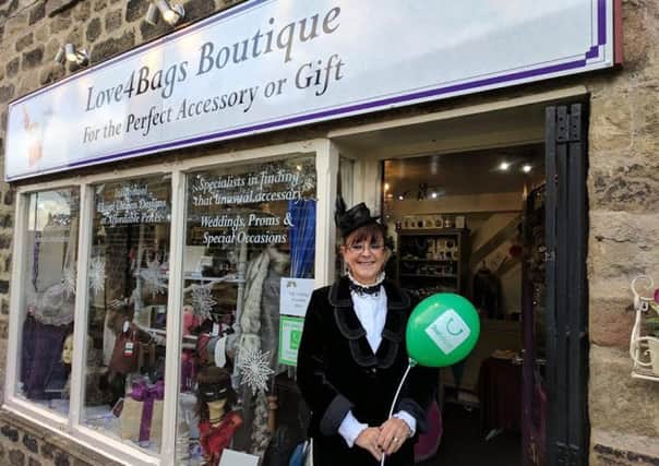 Shopkeeper Carla Waite helping promote the business.