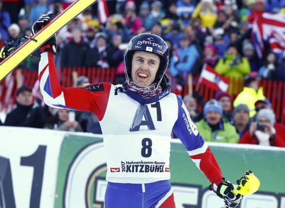 Britain's Dave Ryding celebrates his second place after completing an alpine ski, men's World Cup slalom, in Kitzbuehel, Austria