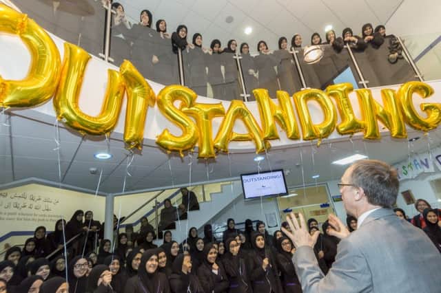 Reason to celebrate.... pupils from Peston Muslim Girls' High are raising the roof after the school was officially declared Outstanding