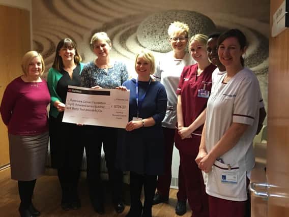 Diane Arcer, third left, and colleagues Pat Park and Helen Lawrenson present Cathy Skidmore, of Rosemere, with their donation in the quiet room at Rosemere Cancer Centre
