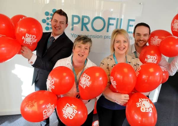 Photo Neil Cross
Ashley Woodcock, Yvonne McKie, Helen Bolton and Michael Billington at Profile Financial Services preparing to become one of the Comic Relief call centres for this March