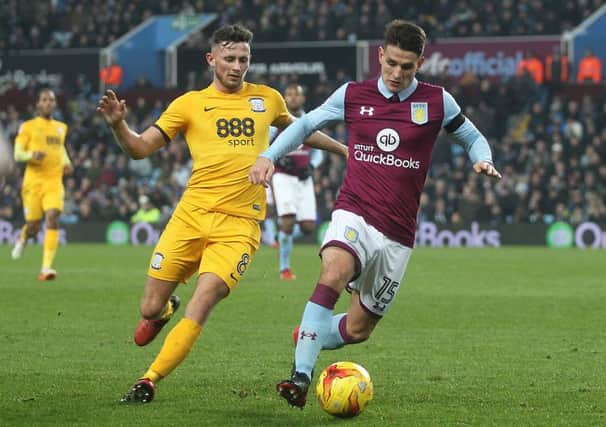 Preston North End's Alan Browne battles with  Aston Villa's Ashley Westwood