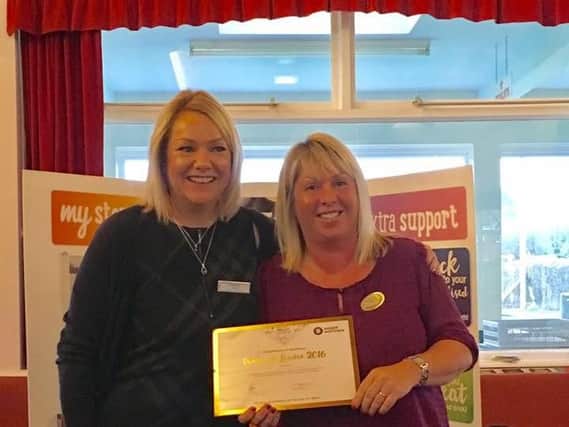 Slimming coach Kim Robinson receives her Diamond Award from WeightWatchers for her outstanding contribution
