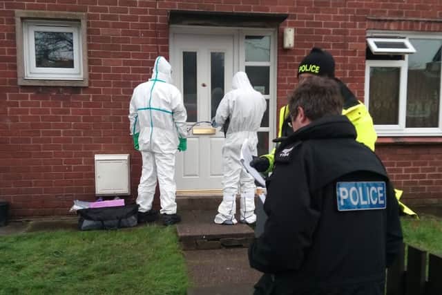 Police and forencis teams begin work after an elderly couple were found dead after a fire in their home in Devonport Close, Chorley