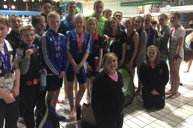 The triumphant Holy Cross swimmers took the at Chorley Schools' swimming gala for the first time