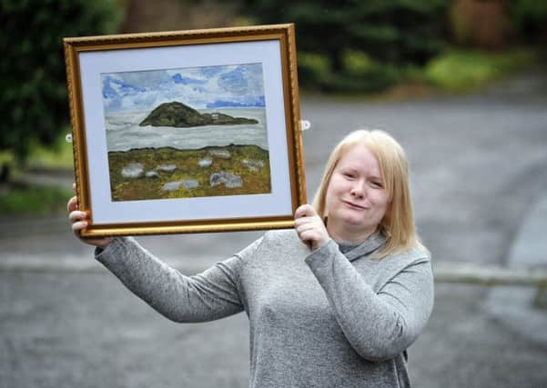 Partially blind artist, Justine Raith has been awarded exhibition space in a gallery, part of Tate Britain pictured at her Clayton Brook home with her painting of Bardsey Island, North Wales