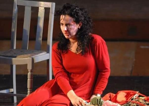Claire Moore, director at Certain Curtain Theatre Company, performs in Lady in Red at Edinburgh Fringe Festival which was shortlisted for an Amnesty International Award.