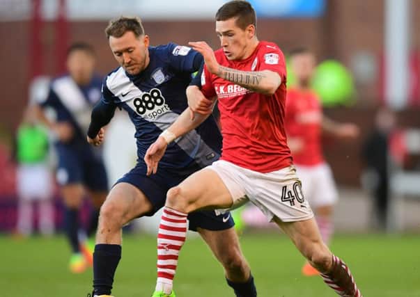 Preston North End's Aiden McGeady vies for possession with Barnsley's Ryan Kent
.