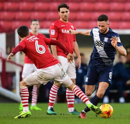 Preston North End's Alan Browne vies for possession with Barnsley's Josh Scowen