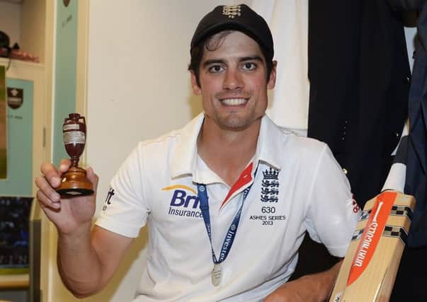 Alastair Cook poses with the Urn in 2013